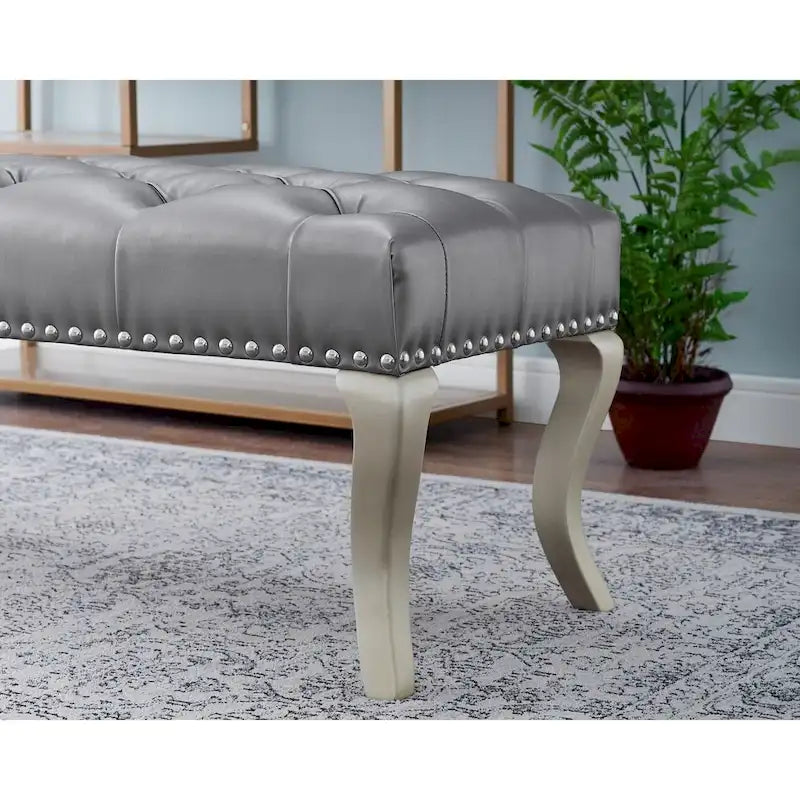 Banc capitonné avec garniture cloutée